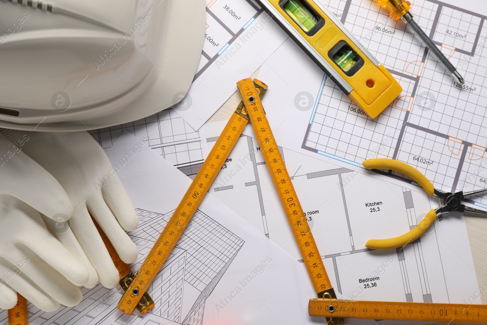 Photo of Flat lay composition with building level and other construction tools on white wooden table