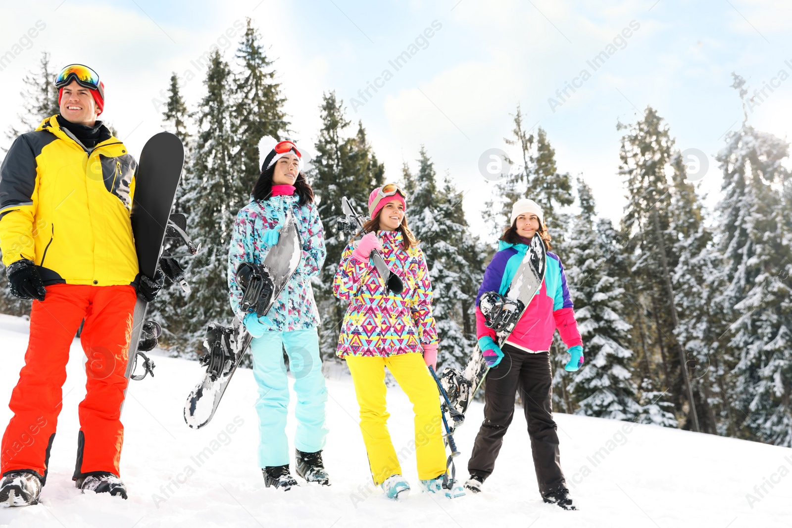 Photo of Group of friends with equipment in snowy mountains. Winter vacation