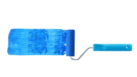 Photo of Roller brush and blue paint stroke on white background, top view