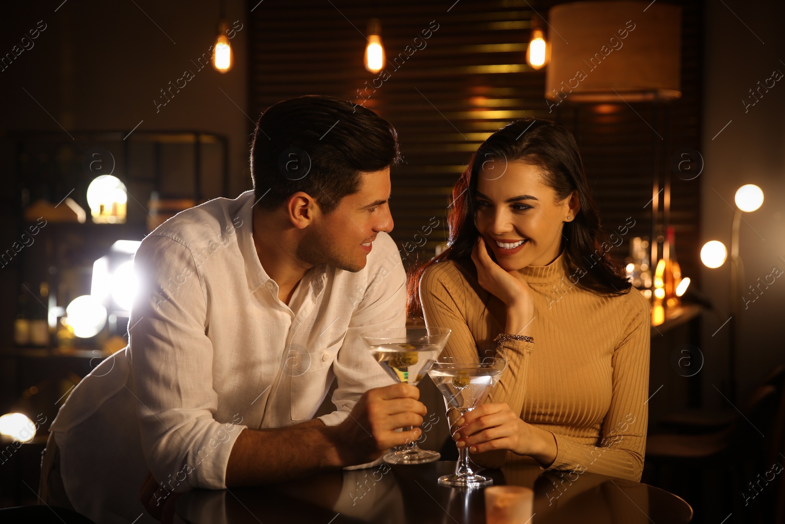 Photo of Man and woman flirting with each other in bar