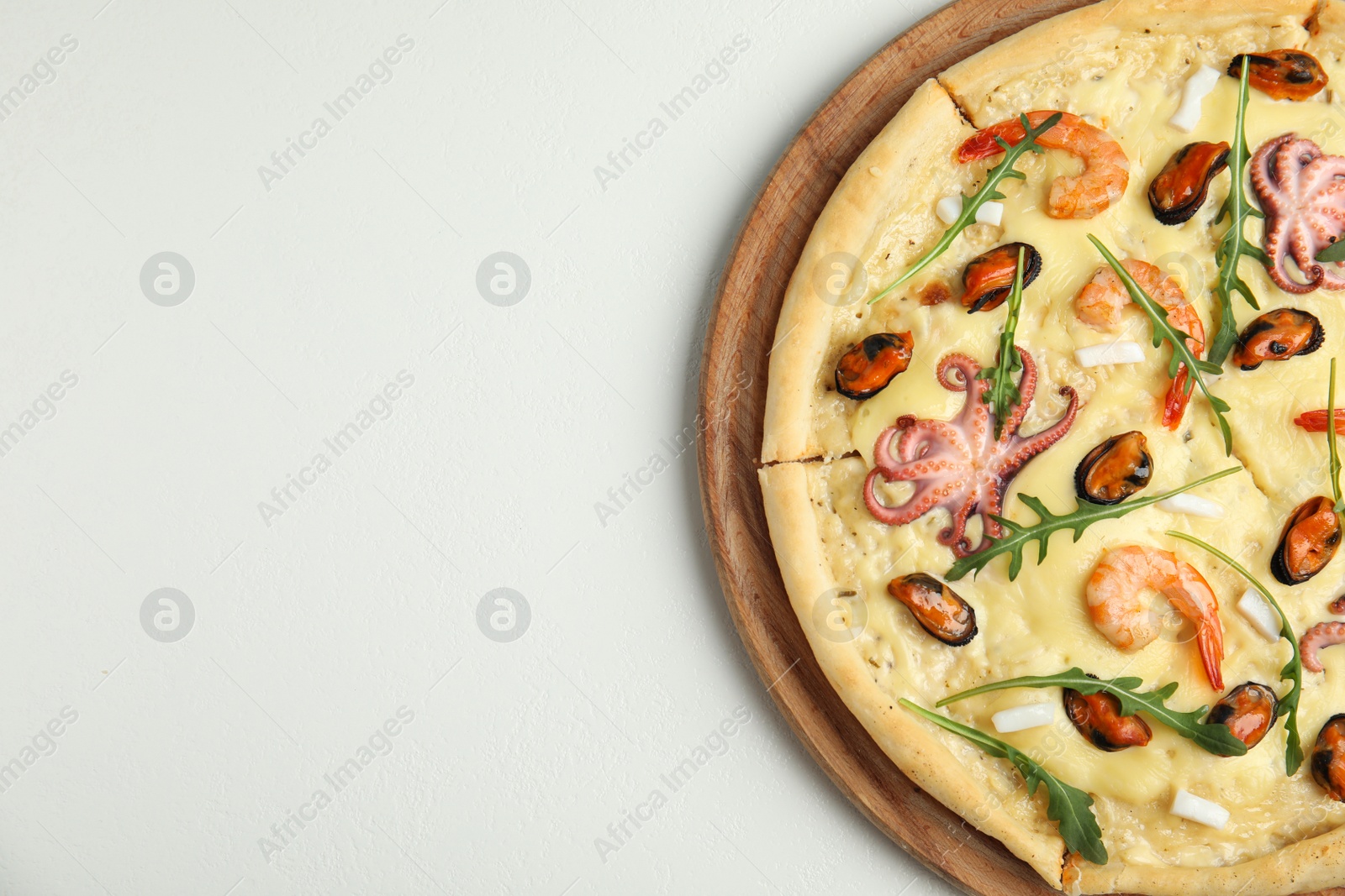 Photo of Delicious seafood pizza on white background, top view