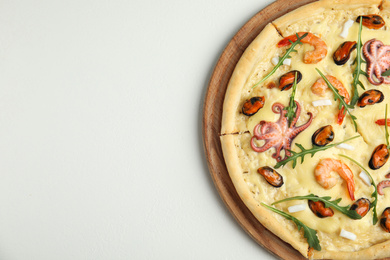 Delicious seafood pizza on white background, top view