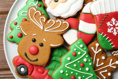 Photo of Different tasty Christmas cookies on wooden table, top view