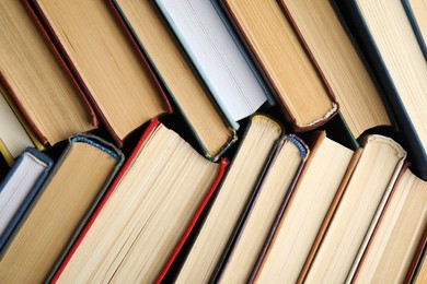 Many different hardcover books as background, top view