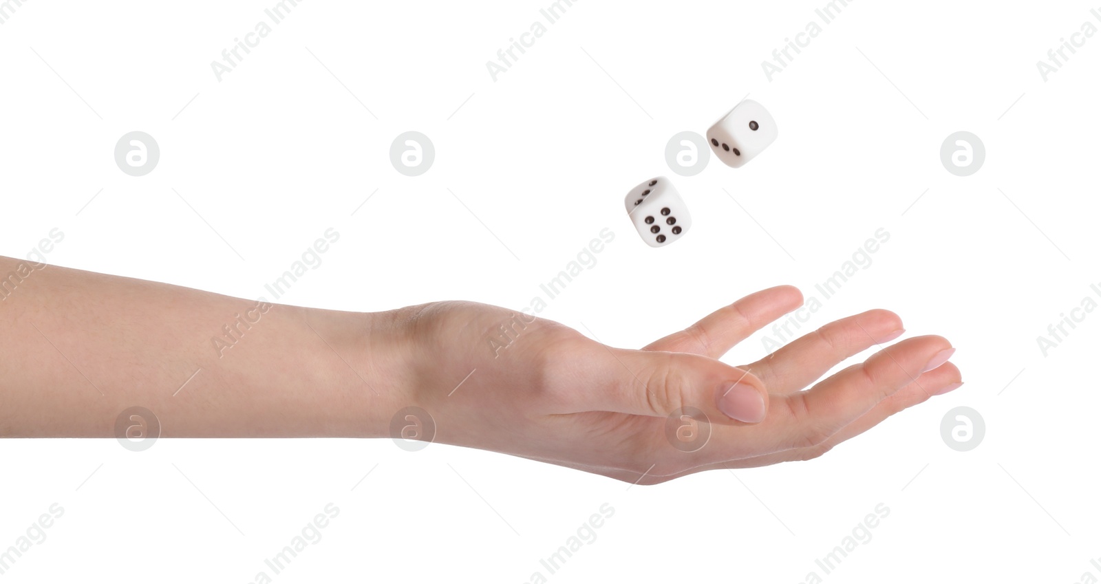 Photo of Woman throwing game dices on white background, closeup