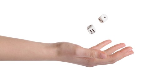 Woman throwing game dices on white background, closeup