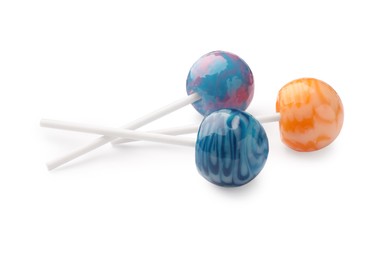 Photo of Three tasty colorful lollipops isolated on white