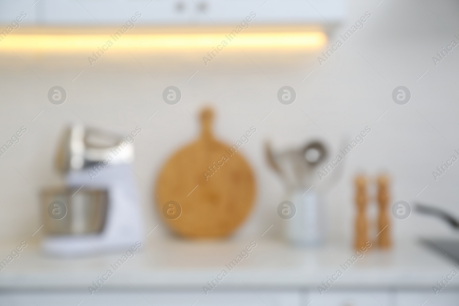 Photo of Blurred view of modern kitchen with utensils