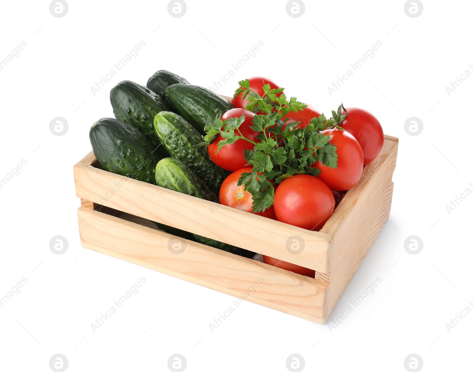 Photo of Wooden crate full of fresh vegetables on white background