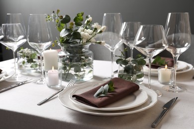 Photo of Beautiful table setting with floral decor indoors