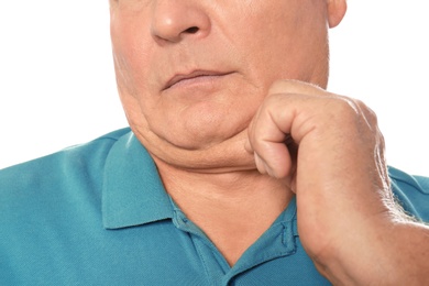 Mature man with double chin on white background, closeup