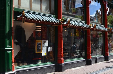 AMSTERDAM, NETHERLANDS - JULY 16, 2022: Beautiful facade of shop at Chinatown, view from outdoors