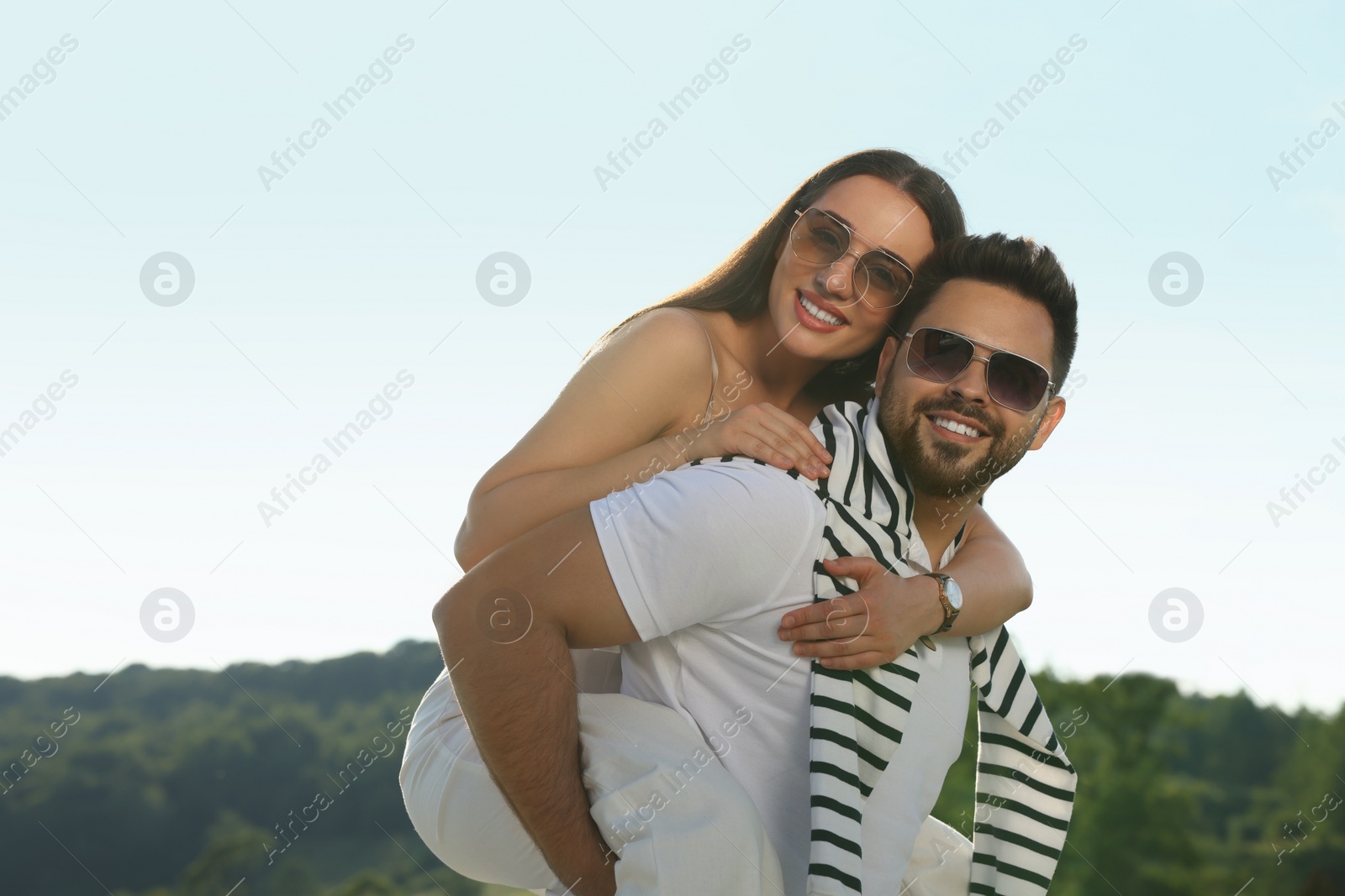 Photo of Romantic date. Beautiful couple spending time together outdoors, space for text