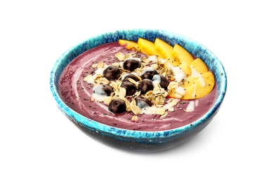 Photo of Bowl with tasty acai smoothie on white background