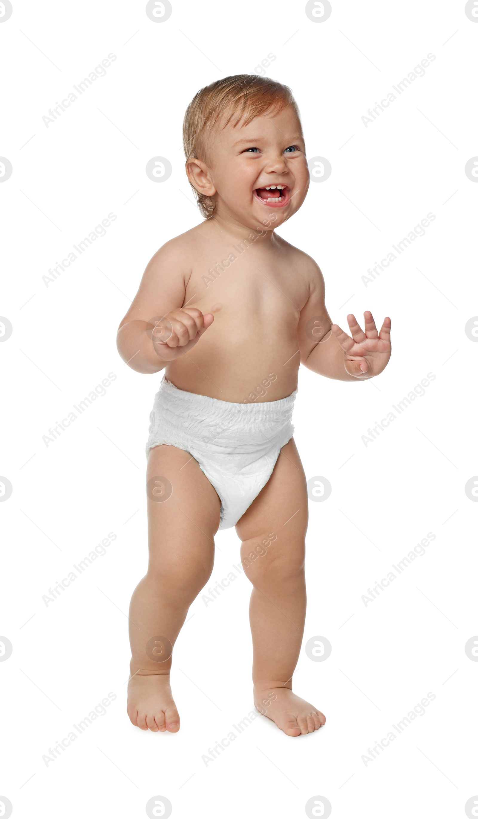 Photo of Cute baby in diaper learning to walk on white background