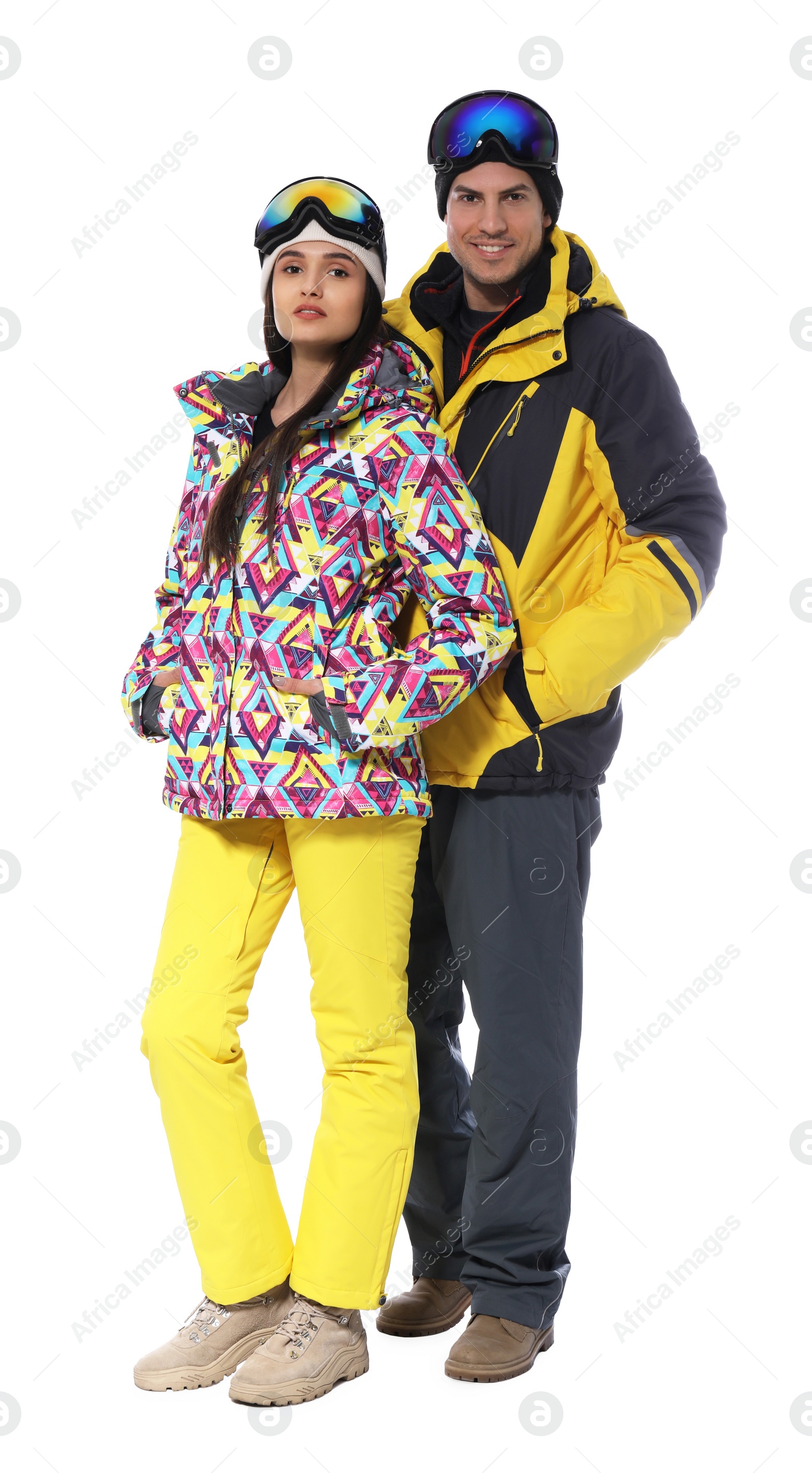 Photo of Couple wearing stylish winter sport clothes on white background