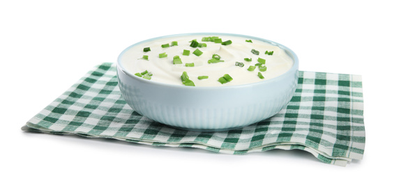 Photo of Fresh sour cream with onion and fabric on white background