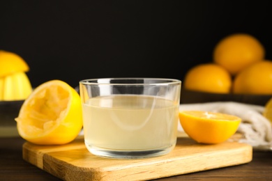 Freshly squeezed lemon juice in glass bowl on table