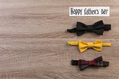 Bow ties on wooden background. Father's day celebration