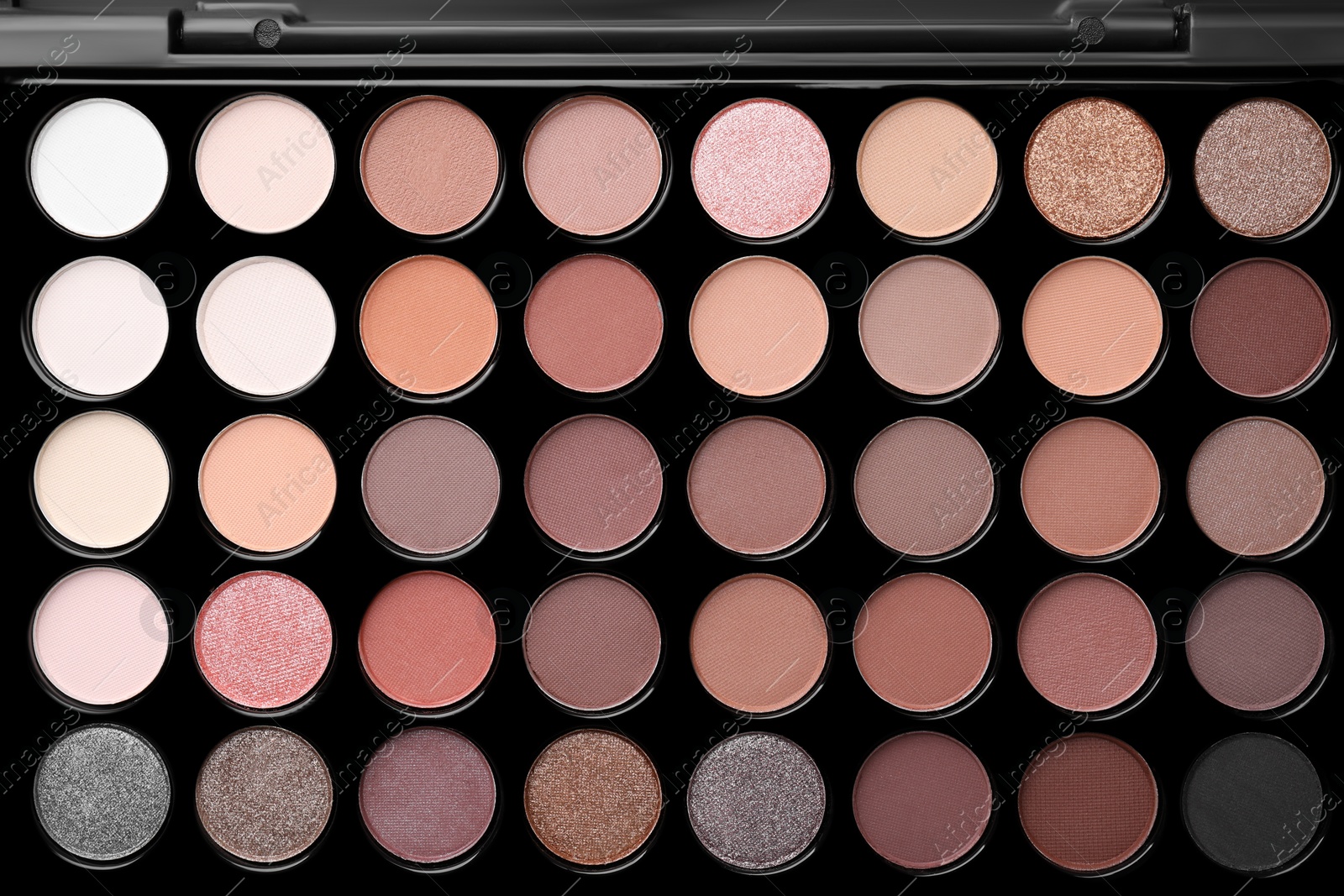 Photo of Beautiful eyeshadow palette as background, top view. Professional cosmetic product