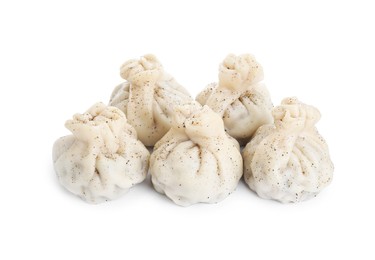 Photo of Tasty fresh khinkali (dumplings) and spices isolated on white. Georgian cuisine