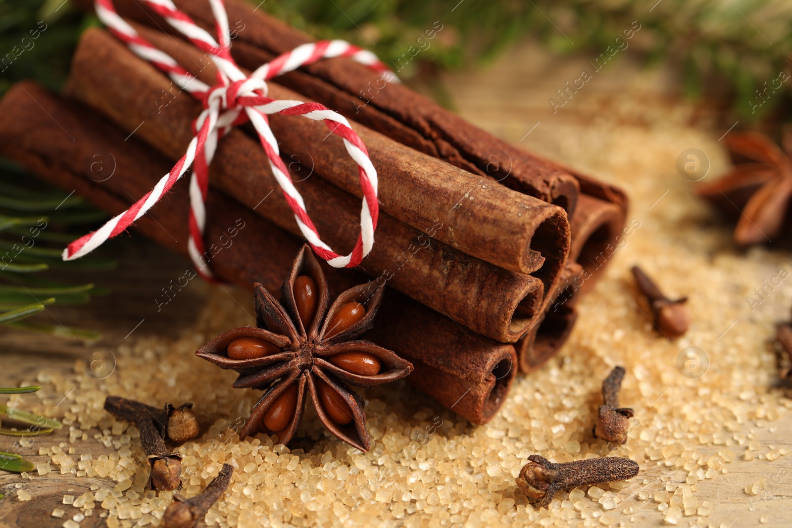 Photo of Different aromatic spices on table, closeup view