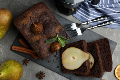 Flat lay composition with tasty pear bread on grey table. Homemade cake