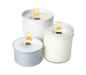Photo of Aromatic candles with wooden wicks on white background