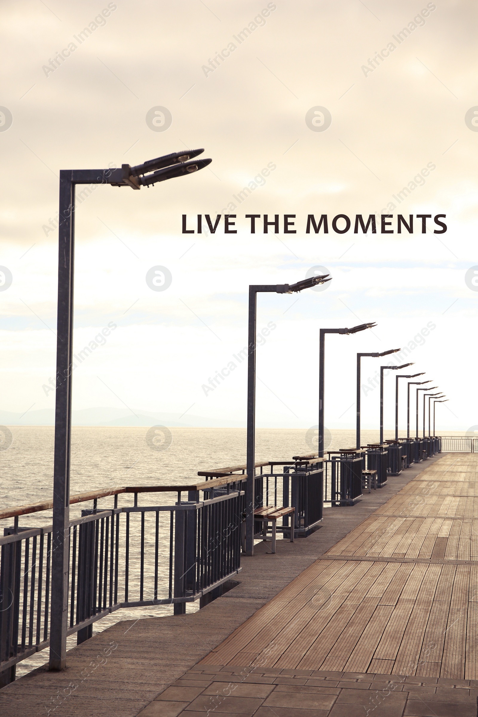 Image of Live the moments, affirmation. Beautiful view of pier near sea outdoors