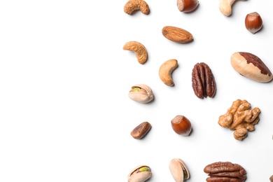 Photo of Composition with organic mixed nuts on white background, top view. Space for text