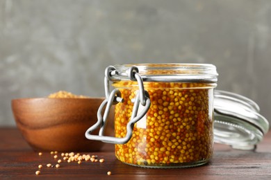 Photo of Whole grain mustard in jar on wooden table