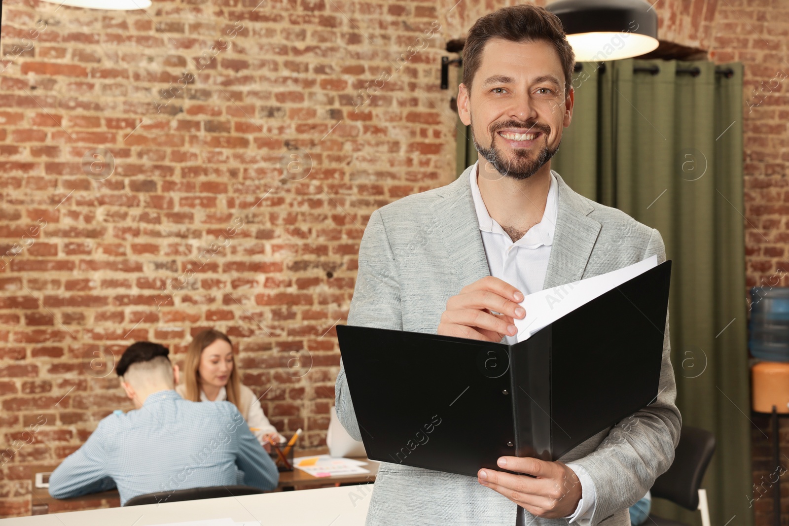 Photo of Portrait of office employee at workplace, space for text