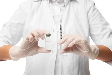 Doctor holding medical syringe and glass vial on white background, closeup