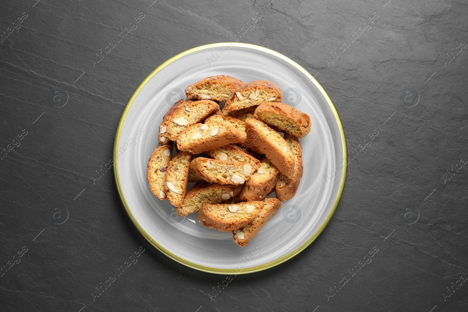 Photo of Traditional Italian almond biscuits (Cantucci) on grey table, top view