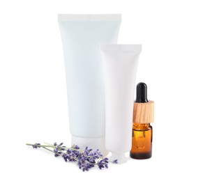 Photo of Different hand care cosmetic products and lavender on white background