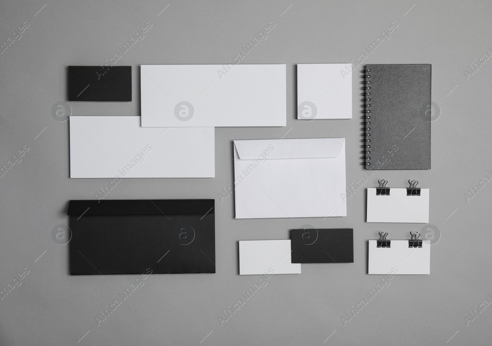 Photo of Flat lay composition with stationery on grey background. Mock up for design