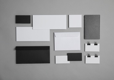 Photo of Flat lay composition with stationery on grey background. Mock up for design