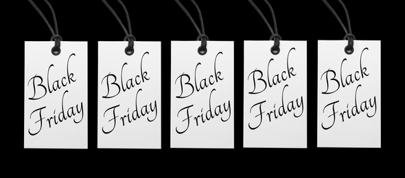 Image of Tags with text BLACK FRIDAY on color background, flat lay. Banner design 