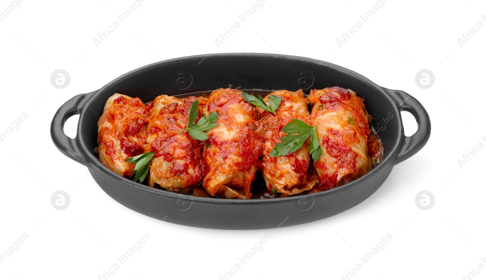 Photo of Baking dish of delicious stuffed cabbage rolls cooked with homemade tomato sauce isolated on white