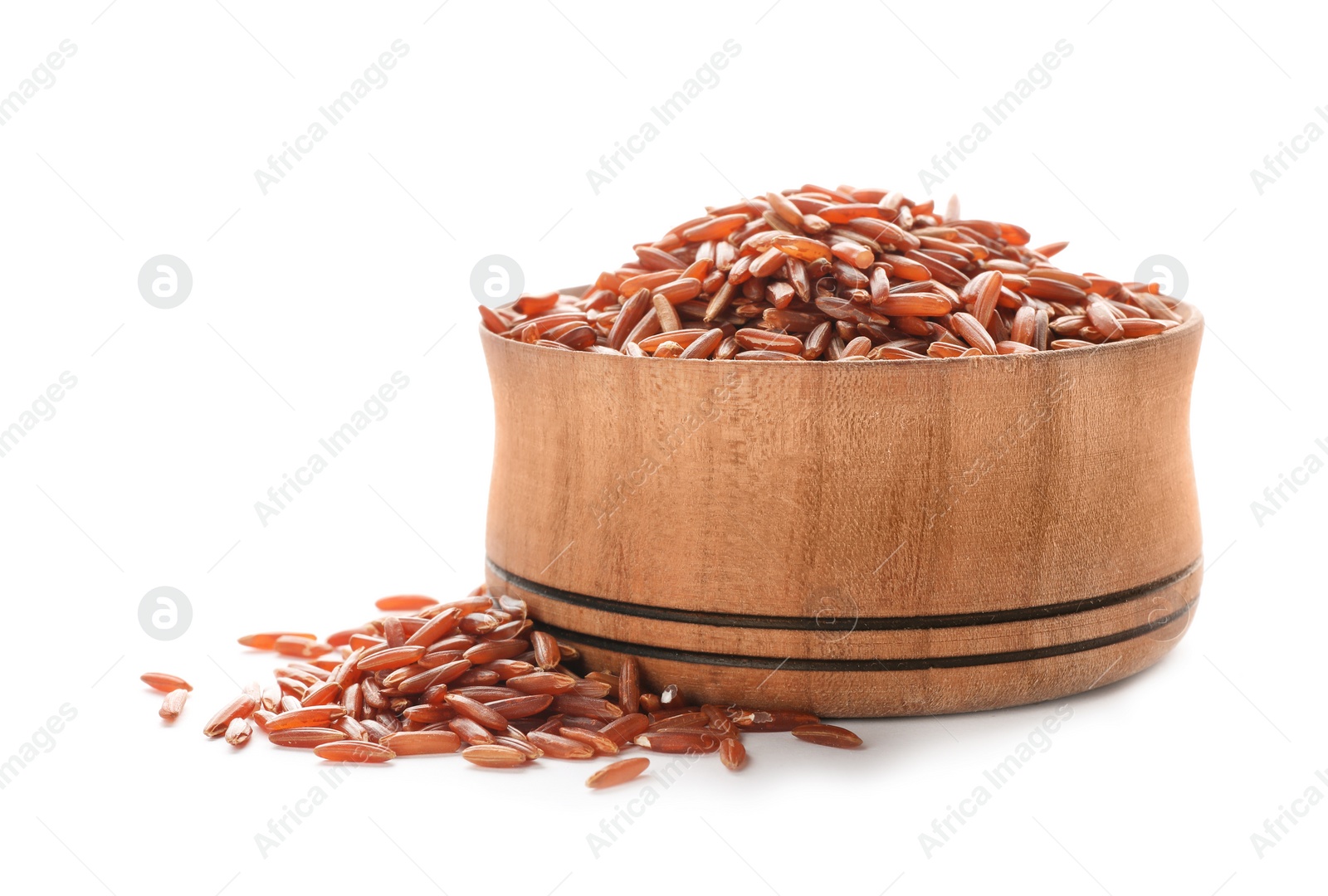 Photo of Wooden bowl with brown rice on white background