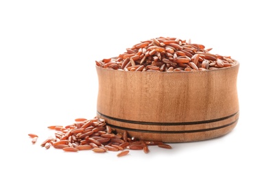 Photo of Wooden bowl with brown rice on white background