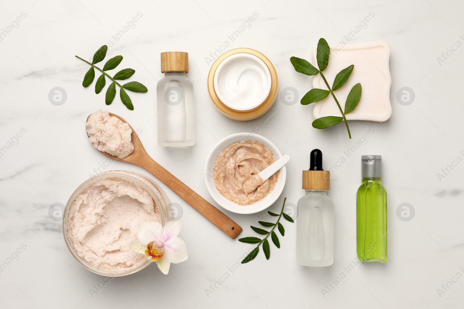 Photo of Flat lay composition with different spa products on white marble table