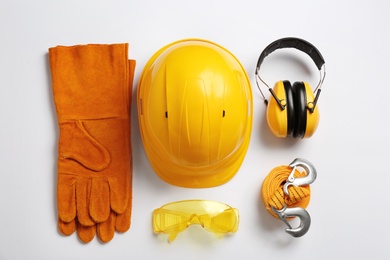 Photo of Flat lay composition with safety equipment on white background