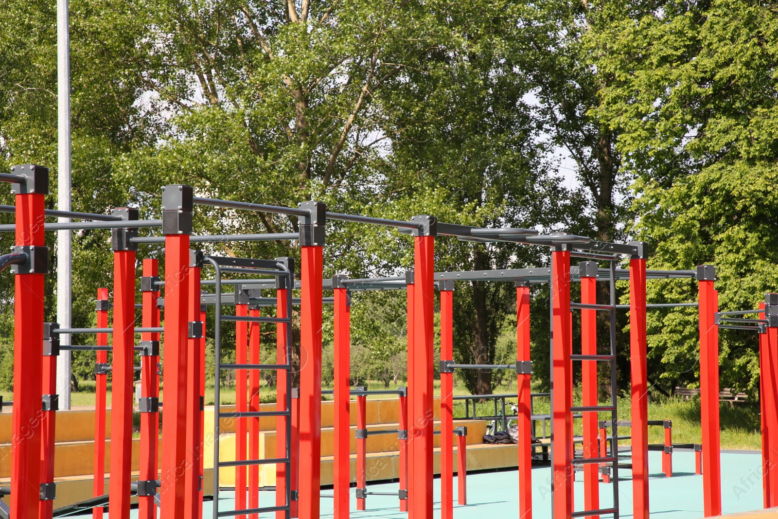 Photo of Empty outdoor gym with exercise equipment in park