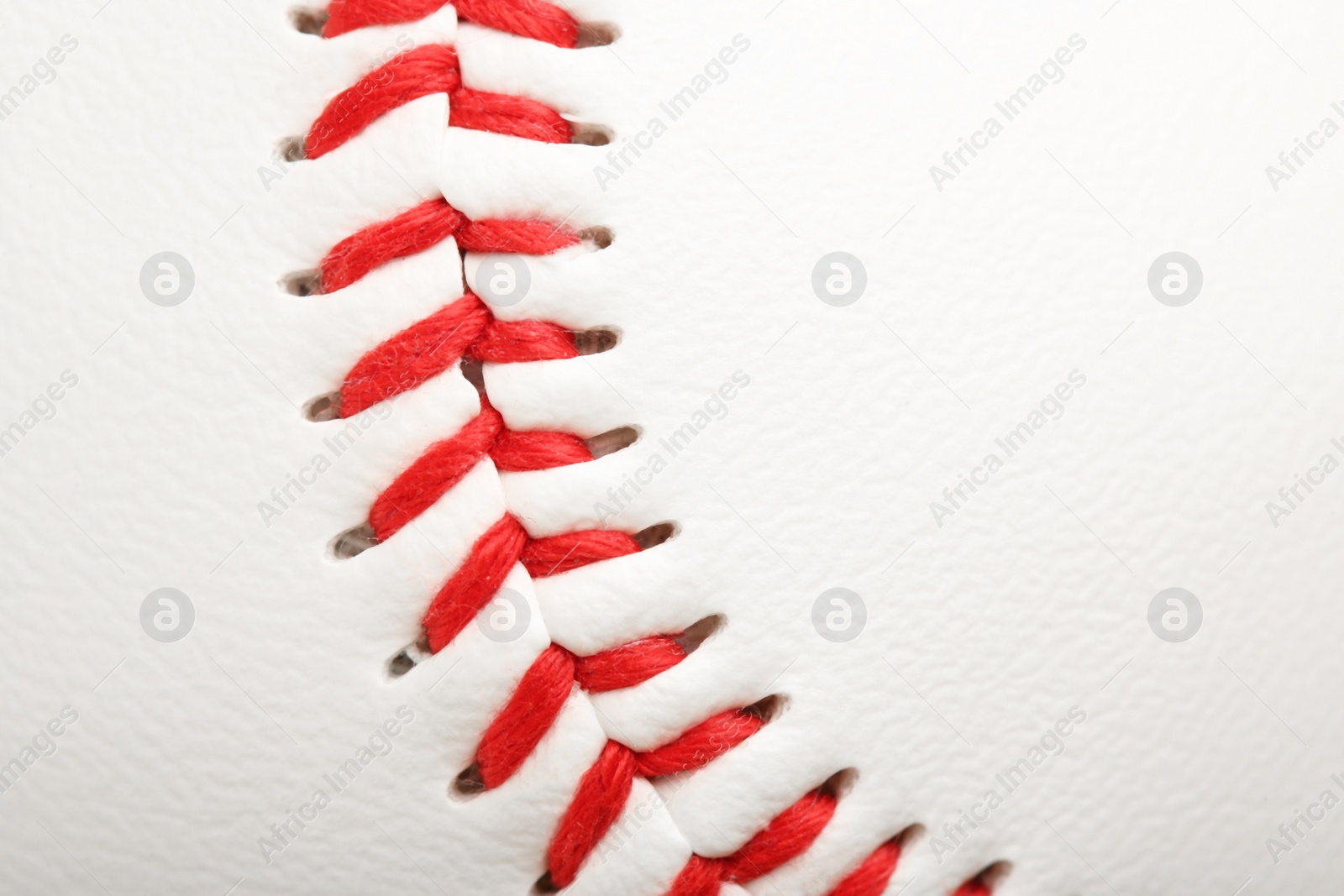 Photo of Baseball ball with stitches as background, closeup