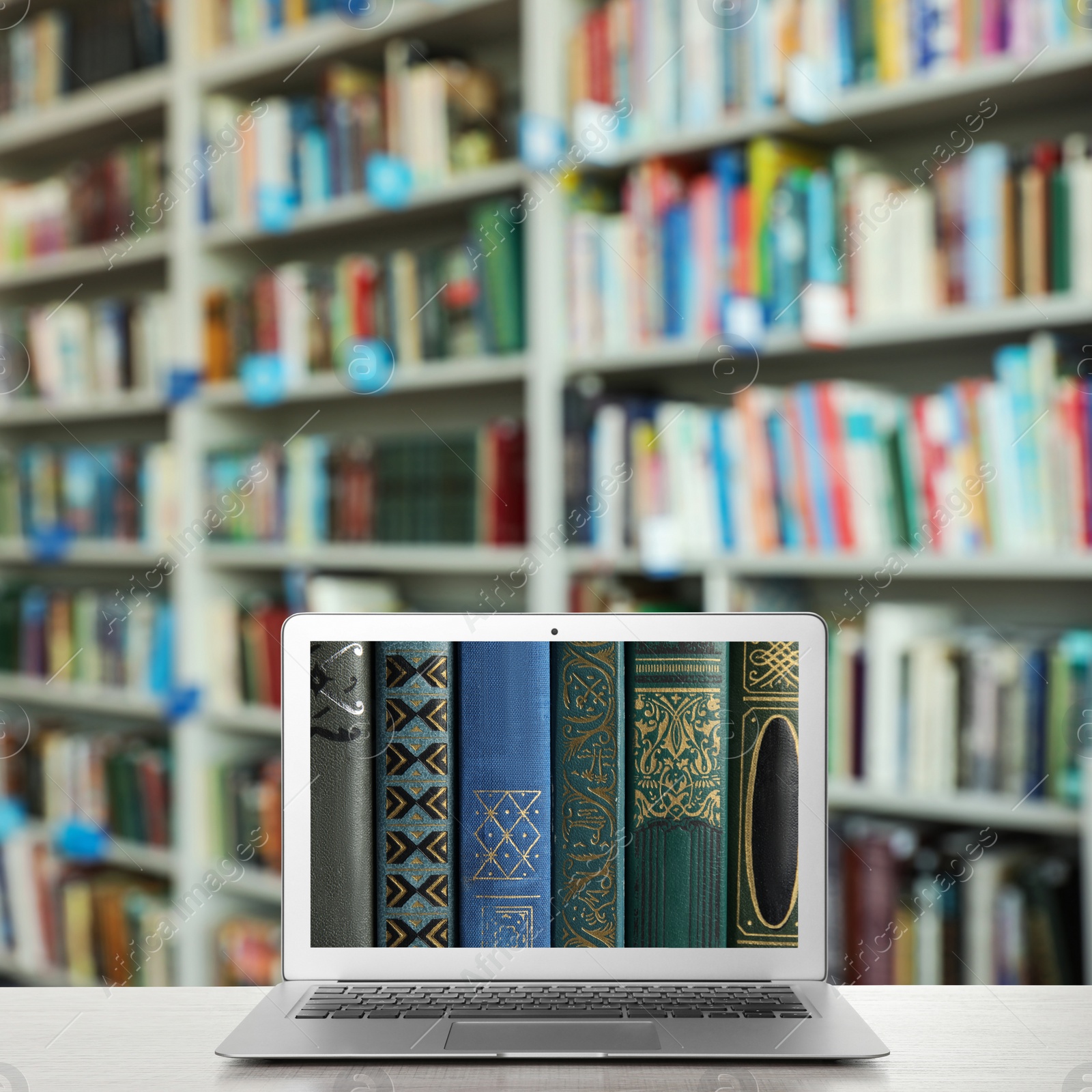 Image of Digital library concept. Modern laptop on table indoors