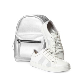 Pair of modern shoes and stylish backpack on white background