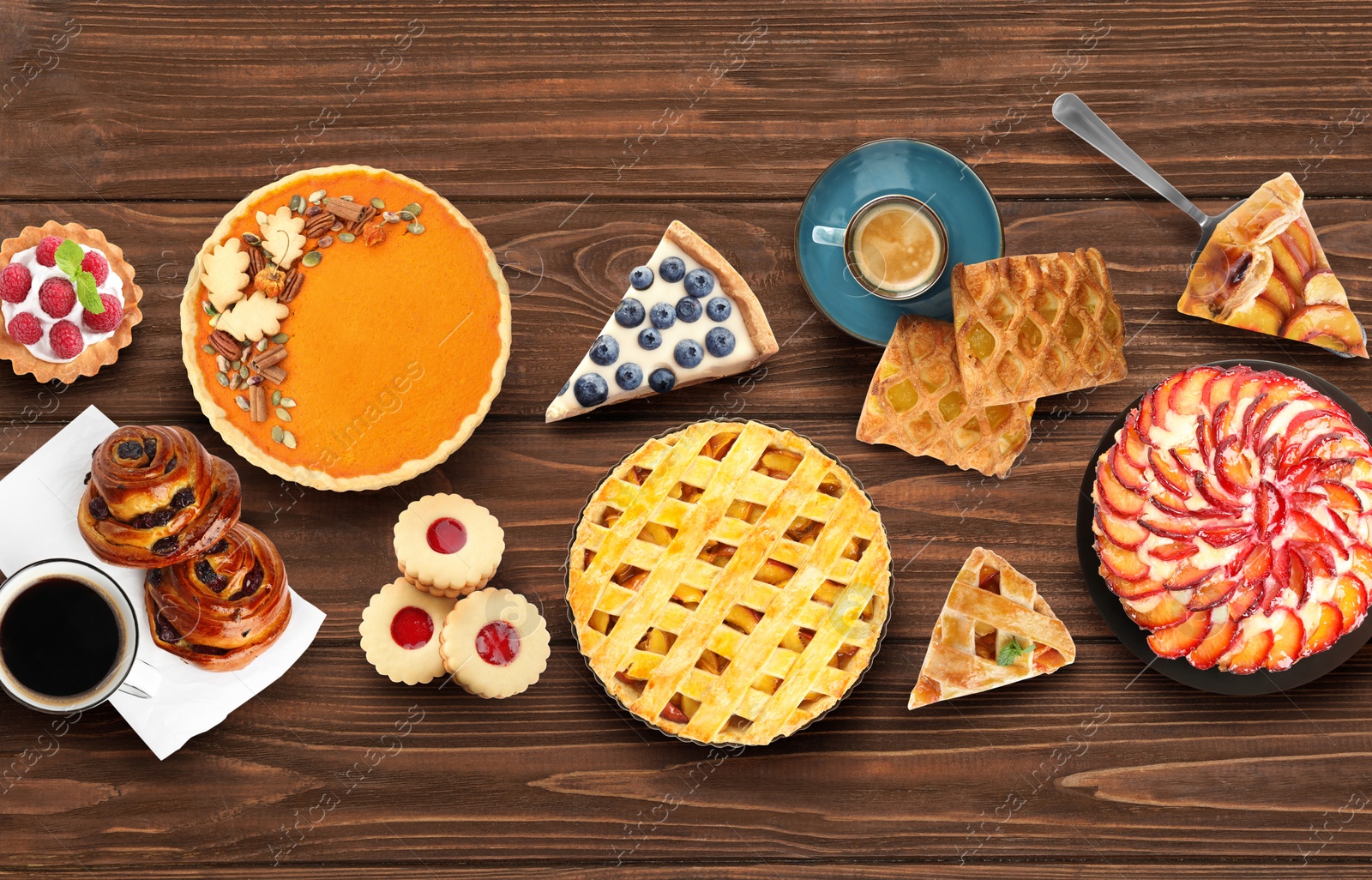 Image of Flat lay composition with different delicious pies on wooden table 