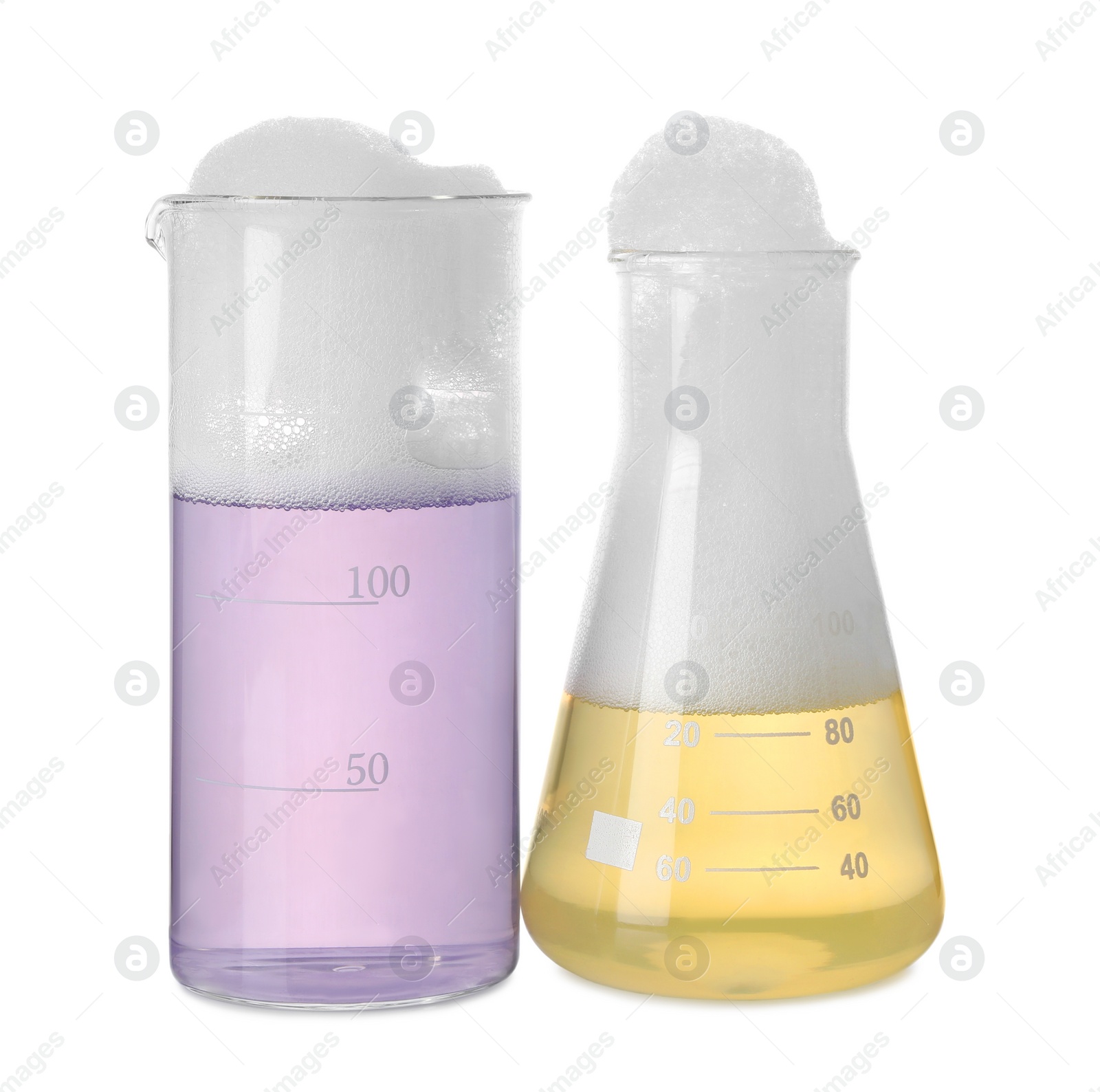 Photo of Laboratory glassware with colorful liquids isolated on white. Chemical reaction