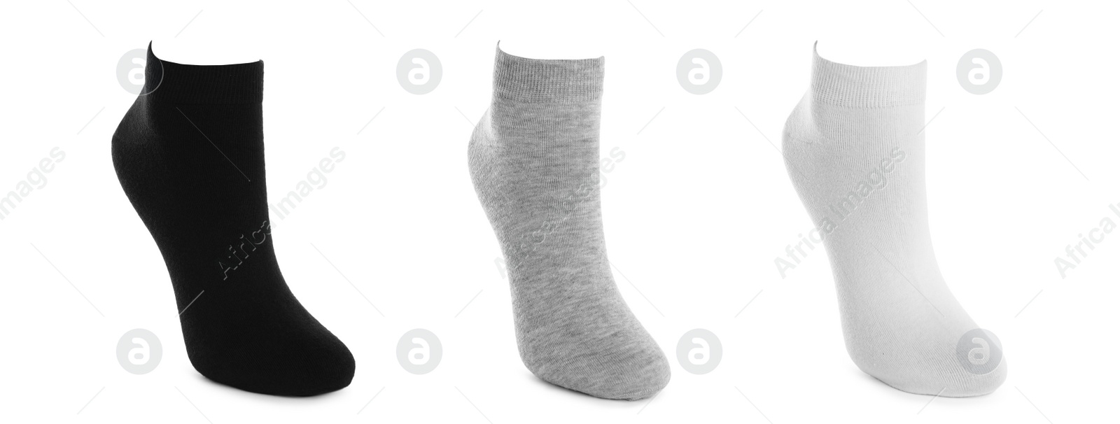 Image of Set with different socks on white background. Banner design